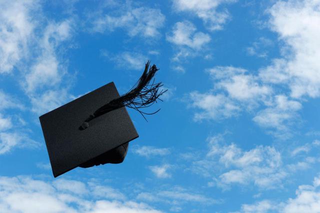Graduation cap flies through the air