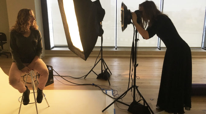 Creative Director Renae Davidson takes portrait photographs in the LightHouse Fitness Studio.