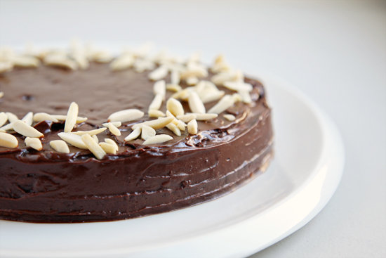 A gooey chocolate cake sprinkled with almonds.