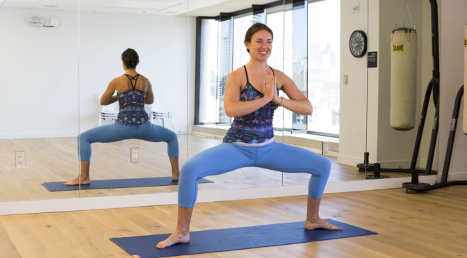 Summer Yoga Instructor Meagan Lynch does yoga in the LightHouse Fitness Studio.