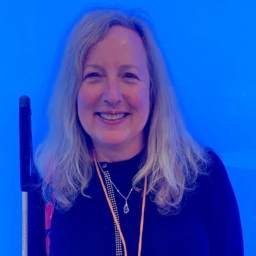 Sheri Albers against a bright blue background