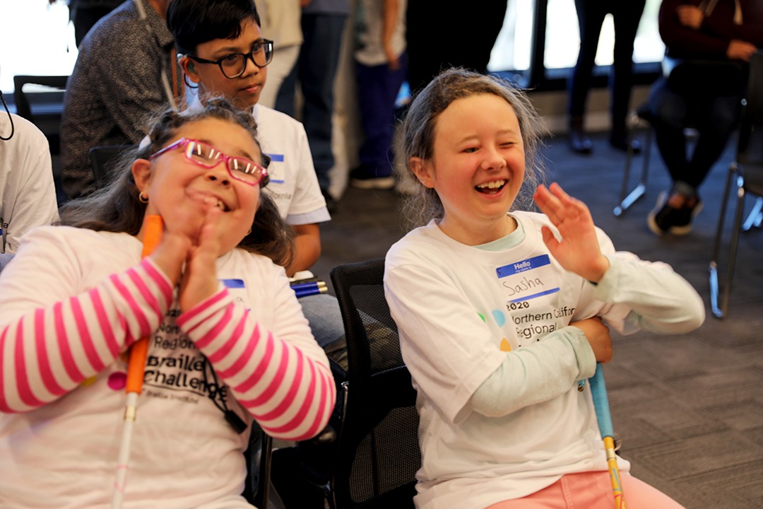 Two friends laughing and having a good time during Braille Challenge 2020
