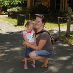 A women holds a young child outdoors