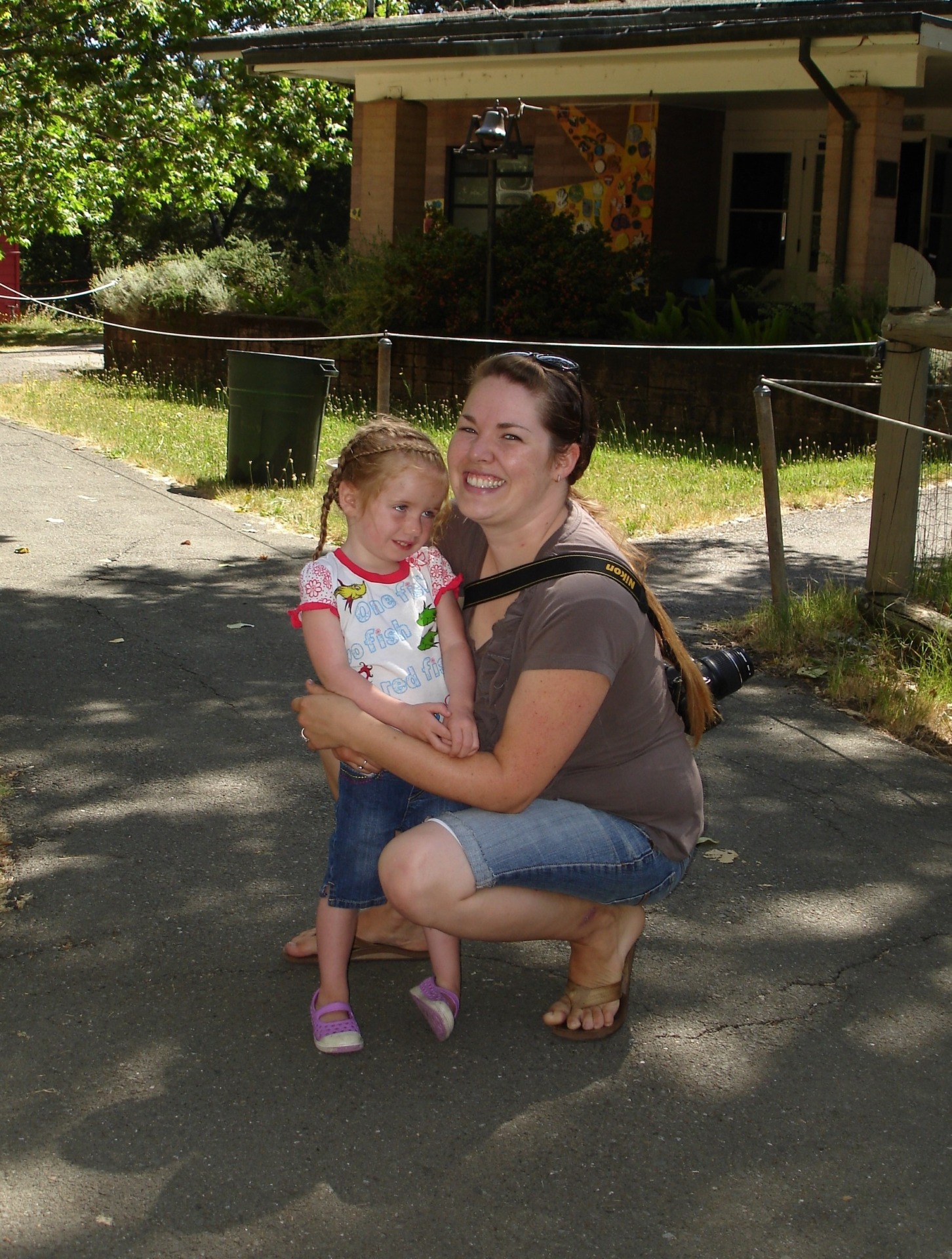 A women holds a young child outdoors