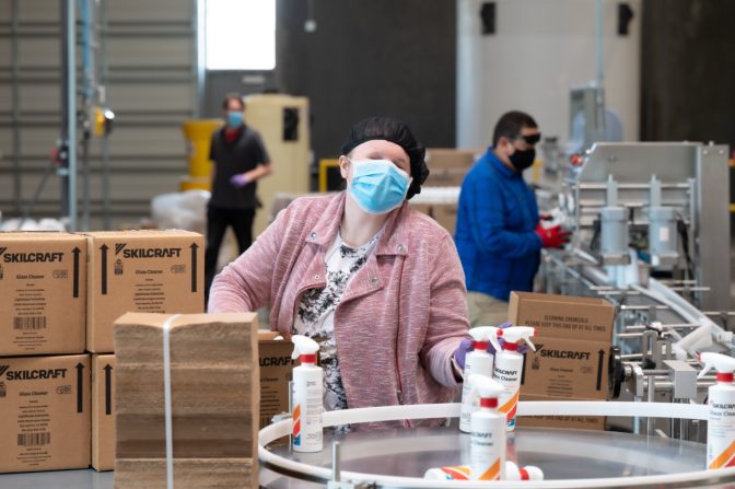 Blind employees work on the assembly line at LightHouse Sirkin Center in Alameda