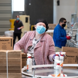 Blind employees work on the assembly line at LightHouse Sirkin Center in Alameda