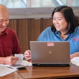 AARP Foundation Tax-Aide volunteer helps a program participant file their taxes