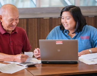 AARP Foundation Tax-Aide volunteer helps a program participant file their taxes
