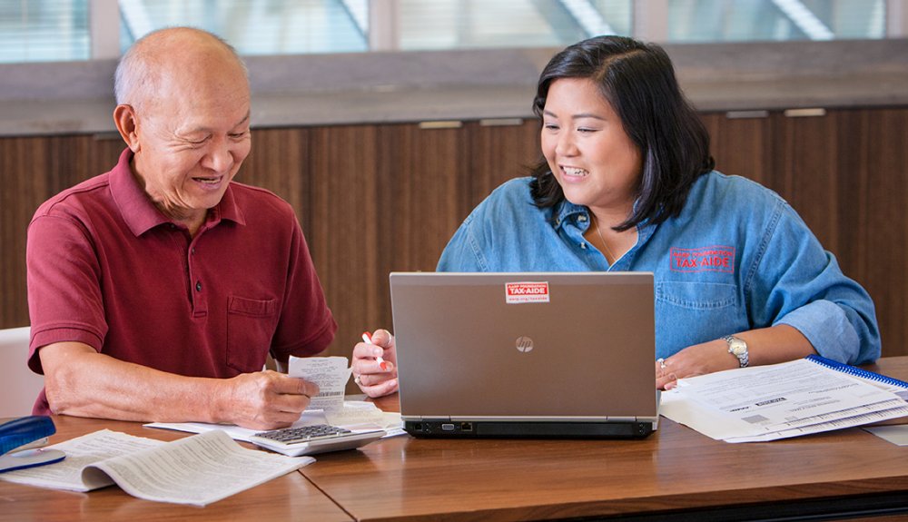 AARP Foundation Tax-Aide volunteer helps a program participant file their taxes