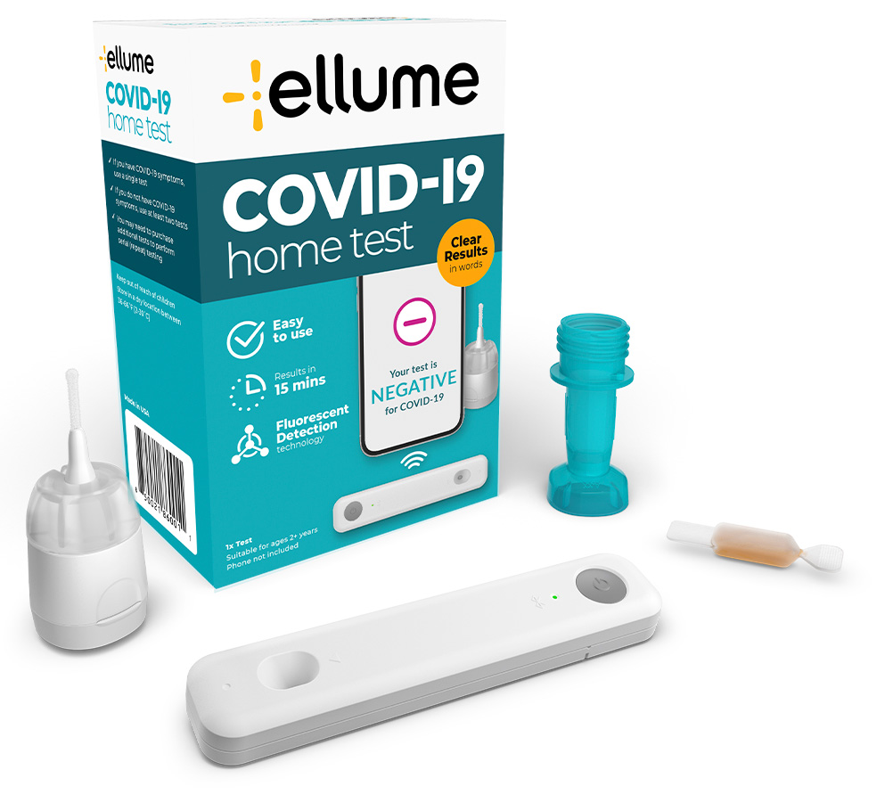 An image of several COVID-19 at-home test packages in a pile on a table.
