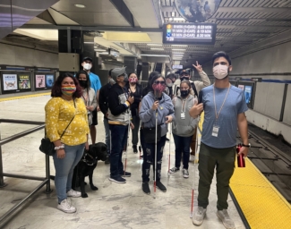 LightHouse staff and students stand on a BART platform