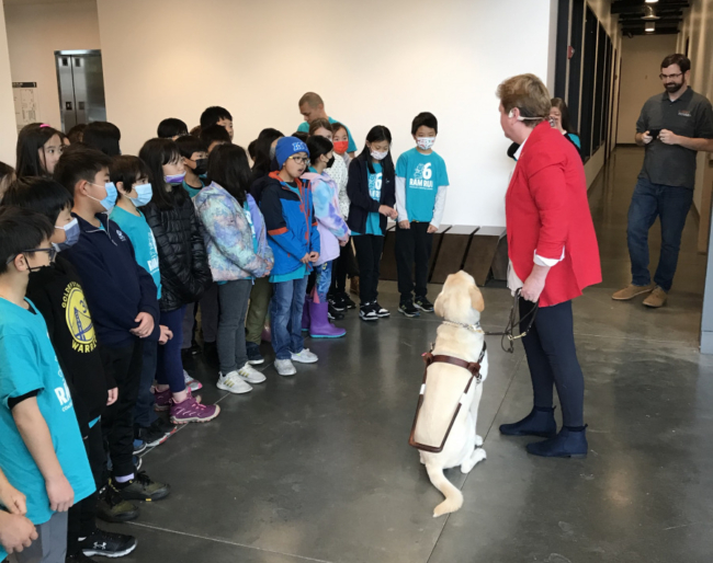 Sharon Giovinazzo, her guide dog Pilot and students at Sirkin Center