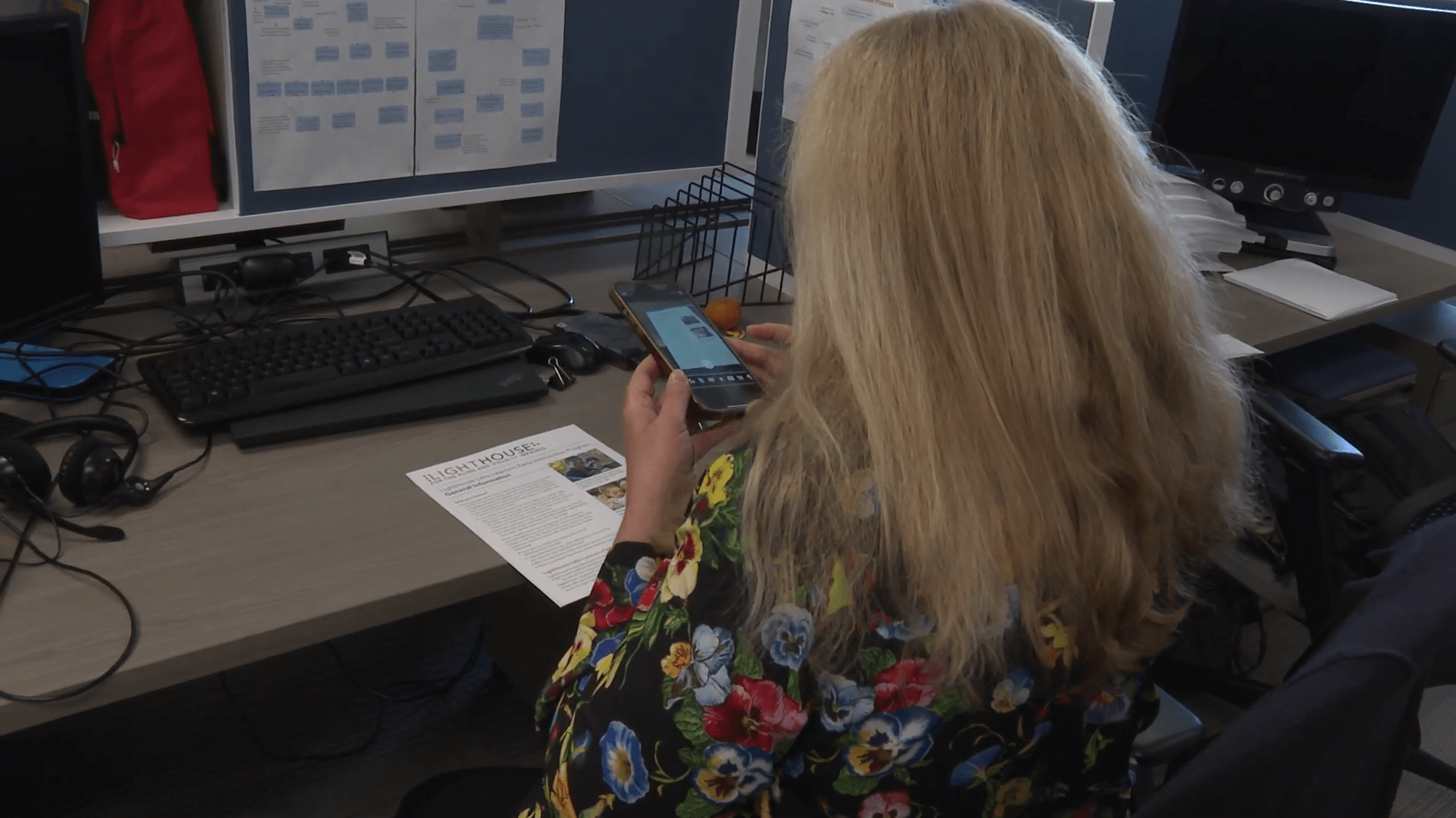 Sheri Albers uses a mobile app to scan a flyer. Credit: Nicole Aponte