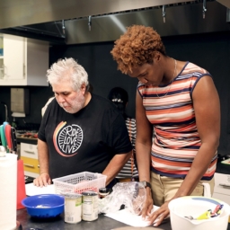 Bobbi Pompey, right, works in the LightHouse Training Kitchen with a student
