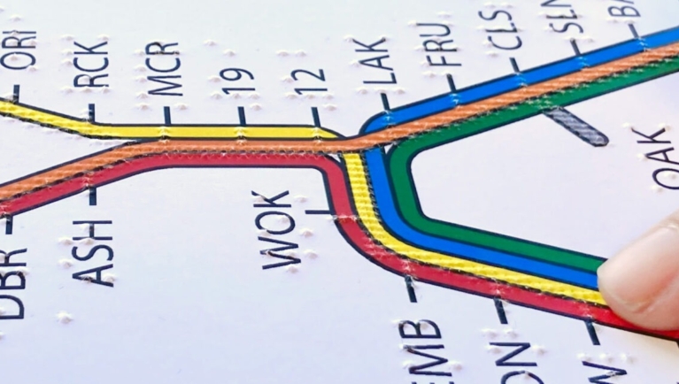 Finger on tactile BART system map.
