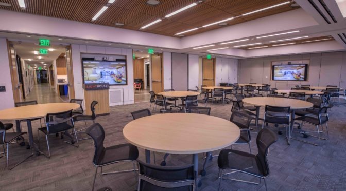A wide-angle view of the Multipurpose Room with circular tables set up at intervals throughout the room.
