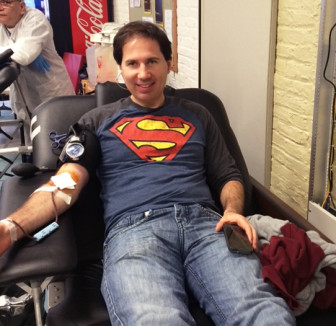 Tim Elder, blind donor, giving blood