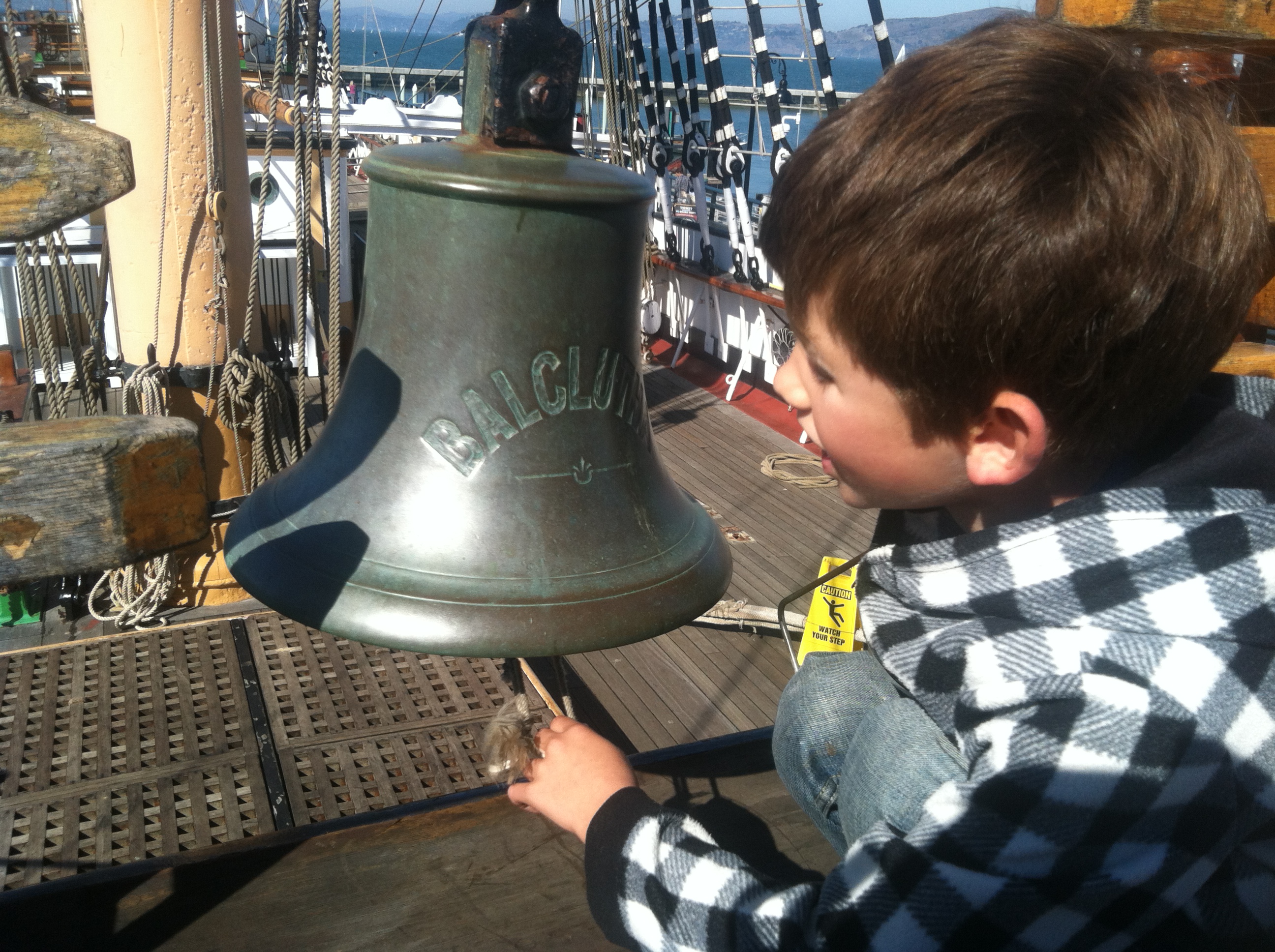 Young Gabe ringing the deck bell aboard the Balclutha, letting others know he is ready to set sail