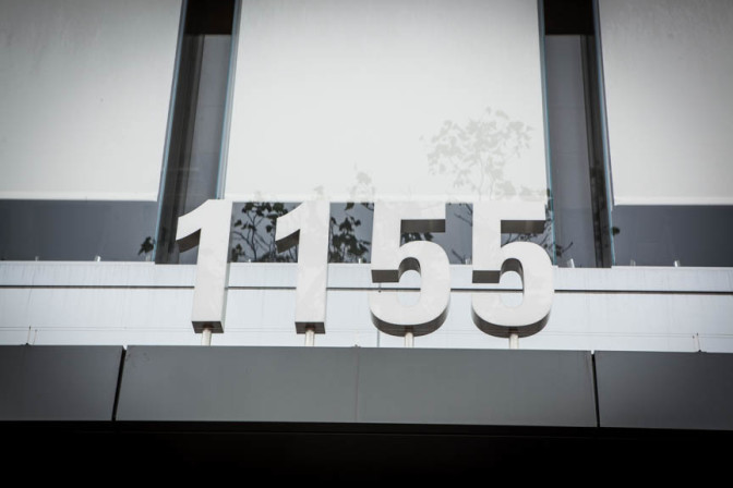 Front doors of our new building showing the street address, 1155