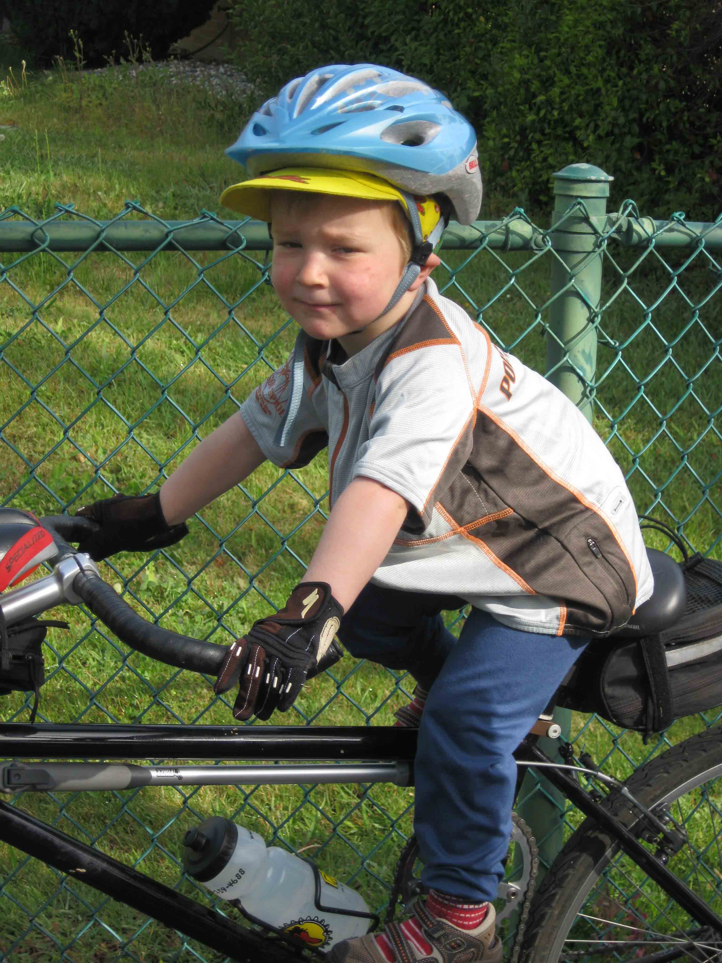 A child riding on a tandem bicycle