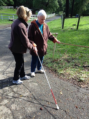 Janis Silva and Certified Orientation and Mobility Specialist Terry Wedler, practice cane travel on EHC’s “Cardiac Hill” at our March Training Retreat