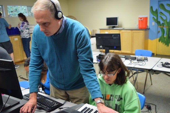 Lead instructor Bill McCann and Jenna Baylis work with adaptive software for composition during Blind Music Academy.