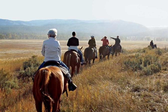 a line of riders on horseback