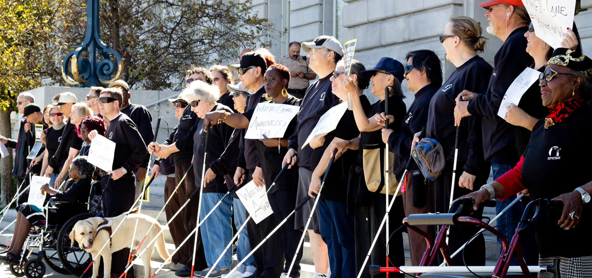 Dozens of blind and visually impaired individuals demonstrate at San Francisco City Hall on White Cane Day 2014