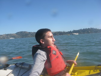 young man kayaking on the ocean