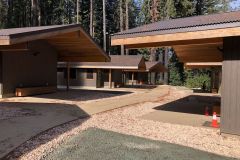 The exterior of the family cabins with paved paths leading through the area from cabin to cabin