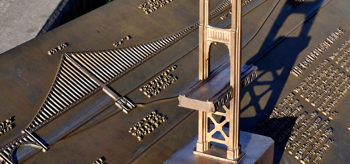 A tactile, bronze display of the Golden Gate Bridge